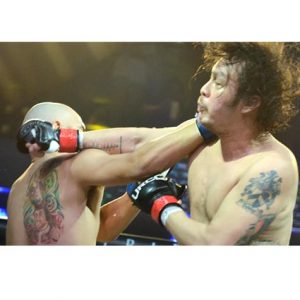 Kiko Matos and Baron Geisler fighting at URCC cage.